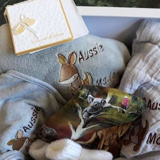 Super cute gift box for an "Aussie" baby. Suitable for either boy or girl. Gift Box contains gift card, fleece blanket, muslin wrap, bib, embroidered bib and bootees.  Everything is handmade in Australia.  Shipping is included in the price.